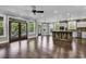 Expansive living room featuring wood floors, an open floorplan, and access to outdoor deck area at 130 Hagar Brown Rd., Murrells Inlet, SC 29576