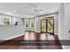 Bright living room featuring hardwood floors and a deck with wooded views at 130 Hagar Brown Rd., Murrells Inlet, SC 29576