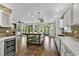 Open floorplan featuring spacious living room with a brick fireplace adjacent to the large kitchen at 130 Hagar Brown Rd., Murrells Inlet, SC 29576