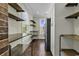 Walk-in pantry featuring custom shelving and cabinets, maximizing storage and organization at 130 Hagar Brown Rd., Murrells Inlet, SC 29576