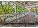 Covered porch with wood ceiling and white railings at 130 Hagar Brown Rd., Murrells Inlet, SC 29576