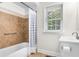 Well-lit bathroom featuring a tiled shower, neutral walls and modern sink at 131 Oak Log Lake Rd., Conway, SC 29526