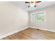 Cozy bedroom with hardwood floors, neutral walls, and a bright window at 131 Oak Log Lake Rd., Conway, SC 29526