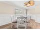 Bright dining room with a stylish white table set, modern ceiling fan, and natural light at 131 Oak Log Lake Rd., Conway, SC 29526