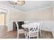 Cozy dining room with elegant wainscoting, modern ceiling fan, and stylish white table set at 131 Oak Log Lake Rd., Conway, SC 29526
