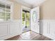 Bright entryway featuring decorative trim, hardwood floors, and a welcoming view of the outdoors at 131 Oak Log Lake Rd., Conway, SC 29526