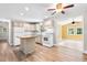 Bright kitchen featuring a center island, white appliances, granite countertops, and an open floor plan at 131 Oak Log Lake Rd., Conway, SC 29526