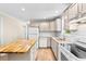 Bright kitchen featuring a center island, white appliances, granite countertops, and ample cabinet space at 131 Oak Log Lake Rd., Conway, SC 29526