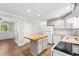 Modern kitchen featuring a center island, white appliances, granite countertops, and sleek cabinets at 131 Oak Log Lake Rd., Conway, SC 29526
