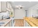 Modern kitchen featuring granite counters, an island, white appliances and an open floor plan at 131 Oak Log Lake Rd., Conway, SC 29526
