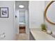 Bright bathroom with a view into bedroom and a framed piece of art at 1356 Glenns Bay Rd. # 208M, Surfside Beach, SC 29575