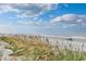 Picturesque beach view with sea oats and ocean activity, a relaxing coastal scene at 1356 Glenns Bay Rd. # 208M, Surfside Beach, SC 29575