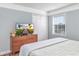 Comfortable bedroom features a dresser, TV, closet and a window at 1356 Glenns Bay Rd. # 208M, Surfside Beach, SC 29575