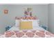 Bedroom features a large bed with bright paisley bedding and colorful art at 1356 Glenns Bay Rd. # 208M, Surfside Beach, SC 29575
