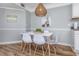 Tastefully decorated dining area with modern furniture and accent art at 1356 Glenns Bay Rd. # 208M, Surfside Beach, SC 29575