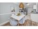 Cozy dining area with modern decor and stylish lighting fixture at 1356 Glenns Bay Rd. # 208M, Surfside Beach, SC 29575
