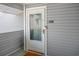 Charming front door with glass panel and house number 208 at 1356 Glenns Bay Rd. # 208M, Surfside Beach, SC 29575