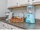 Stylish kitchen countertop featuring a coffee bar, a vintage style snow cone machine, and white cabinets at 1356 Glenns Bay Rd. # 208M, Surfside Beach, SC 29575