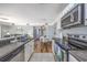 Bright, open-concept kitchen leading to dining and living areas at 1356 Glenns Bay Rd. # 208M, Surfside Beach, SC 29575