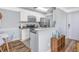 Bright kitchen with stainless steel appliances, a breakfast bar, and a cozy dining nook nearby at 1356 Glenns Bay Rd. # 208M, Surfside Beach, SC 29575