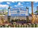 Surfside Beach Fishing Pier sign with nautical decor, welcoming visitors at 1356 Glenns Bay Rd. # 208M, Surfside Beach, SC 29575