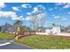 Community tennis courts with chain link fence, shed and shaded seating area at 1356 Glenns Bay Rd. # 208M, Surfside Beach, SC 29575
