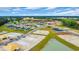 Aerial view of the community featuring picturesque ponds, green spaces, and ongoing construction at 1368 Palm Springs Paloma Dr, Longs, SC 29568