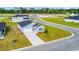Aerial view of the home showing a manicured lawn and driveway in a vibrant neighborhood at 1368 Palm Springs Paloma Dr, Longs, SC 29568