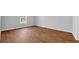 Neutral bedroom featuring wood-look flooring and a window at 1368 Palm Springs Paloma Dr, Longs, SC 29568