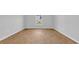 Bright bedroom featuring wood-look flooring and a window at 1368 Palm Springs Paloma Dr, Longs, SC 29568