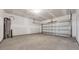 Unfinished garage featuring concrete flooring and drywall walls at 1368 Palm Springs Paloma Dr, Longs, SC 29568