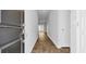 Inviting hallway features wood-look flooring and neutral walls, leading to a bright living space at 1368 Palm Springs Paloma Dr, Longs, SC 29568