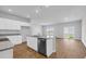 Open concept kitchen with stainless steel appliances, island and light filled eating area at 1368 Palm Springs Paloma Dr, Longs, SC 29568