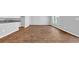 Open living room featuring wood-look floors and abundant natural light at 1368 Palm Springs Paloma Dr, Longs, SC 29568