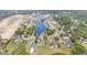 Aerial view of the community showcasing a large pond with a fountain and beautiful single-Gathering homes at 1400 James Island Ave., North Myrtle Beach, SC 29582