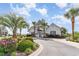 A welcoming clubhouse framed by palm trees and lush landscaping creates a tropical entrance at 1400 James Island Ave., North Myrtle Beach, SC 29582