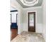 Elegant foyer featuring decorative tile flooring, a wood door, and ornate trim work at 1400 James Island Ave., North Myrtle Beach, SC 29582