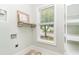 Laundry room featuring a large window, built in storage, and an included folding rack at 1400 James Island Ave., North Myrtle Beach, SC 29582
