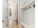 Mud room with tile flooring and custom wall hooks and storage for convenient organization at 1400 James Island Ave., North Myrtle Beach, SC 29582