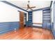 Well-appointed home office with custom shelving, a barn door, and rich hardwood floors at 1400 James Island Ave., North Myrtle Beach, SC 29582