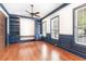 Spacious office with custom built-in shelving, wood floors, and natural light from large windows at 1400 James Island Ave., North Myrtle Beach, SC 29582