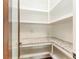 Walk-in pantry featuring granite counters and ample shelving providing generous storage space at 1400 James Island Ave., North Myrtle Beach, SC 29582