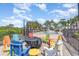 Colorful lounge chairs surround a cozy fire pit and refreshing pool, creating the perfect outdoor retreat at 1400 James Island Ave., North Myrtle Beach, SC 29582