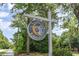 Sign for Charleston Landing in front of beautiful foliage on a sunny day at 1400 James Island Ave., North Myrtle Beach, SC 29582