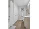 Well-lit bathroom featuring a shower, storage, a sink, and a framed print on the wall at 142 Ella Kinley Circle # 402, Myrtle Beach, SC 29588