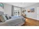 This bedroom features natural light, light-colored walls and decor, and a cozy desk area at 142 Ella Kinley Circle # 402, Myrtle Beach, SC 29588