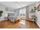 Sun-drenched bedroom featuring wood floors and a charming seating area at 142 Ella Kinley Circle # 402, Myrtle Beach, SC 29588