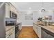 Well-equipped kitchen with stainless steel appliances and granite countertops at 142 Ella Kinley Circle # 402, Myrtle Beach, SC 29588