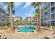 Beautiful community pool surrounded by palm trees and comfortable lounge chairs at 142 Ella Kinley Circle # 402, Myrtle Beach, SC 29588