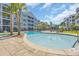 Scenic pool area with palm trees and lounge chairs, perfect for relaxation and enjoying the outdoors at 142 Ella Kinley Circle # 402, Myrtle Beach, SC 29588